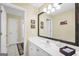 Bathroom vanity with white cabinets, large mirror, and neutral paint offering a clean aesthetic at 39 Gabrielle Ct, Stockbridge, GA 30281