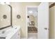 The bathroom features vanity, mirror, and access to the next room at 39 Gabrielle Ct, Stockbridge, GA 30281
