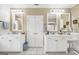 Bathroom featuring double sinks, white cabinets, and tile flooring at 39 Gabrielle Ct, Stockbridge, GA 30281