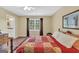 Comfortable bedroom with a ceiling fan, window, hardwood floors, and ensuite access at 39 Gabrielle Ct, Stockbridge, GA 30281