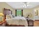 Inviting bedroom featuring a comfortable bed, side table and rustic decor accents at 39 Gabrielle Ct, Stockbridge, GA 30281
