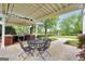 Outdoor patio space offering a grill, patio furniture, and view of the spacious fenced in backyard at 39 Gabrielle Ct, Stockbridge, GA 30281