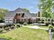 Charming brick home exterior with a well-manicured lawn and outdoor entertainment area at 39 Gabrielle Ct, Stockbridge, GA 30281