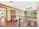 Elegant foyer with hardwood floors, wood trim, secretary, and chandelier at 39 Gabrielle Ct, Stockbridge, GA 30281