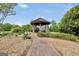 Lush backyard landscaping surrounds this charming backyard gazebo at 39 Gabrielle Ct, Stockbridge, GA 30281