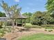 Gazebo on beautifully landscaped backyard with a manicured lawn and mature trees at 39 Gabrielle Ct, Stockbridge, GA 30281