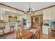 Kitchen featuring eat-in dining, wood floors, stainless appliances, and white cabinets at 39 Gabrielle Ct, Stockbridge, GA 30281