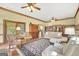 Spacious living room featuring hardwood floors, cozy seating, and an abundance of natural light from large windows at 39 Gabrielle Ct, Stockbridge, GA 30281