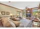 Comfortable living room with a brick fireplace, plush seating, and large windows for a bright and airy atmosphere at 39 Gabrielle Ct, Stockbridge, GA 30281
