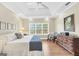 This is the main bedroom, complete with hardwood floors, a tray ceiling, and ample natural light from large windows at 39 Gabrielle Ct, Stockbridge, GA 30281