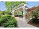 Inviting outdoor kitchen area featuring a built-in grill and charming pergola with space to entertain at 39 Gabrielle Ct, Stockbridge, GA 30281