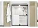 White shower, dark metal trim and accents with shelves for storage at 39 Gabrielle Ct, Stockbridge, GA 30281