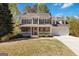 Charming two-story home featuring a welcoming front porch, stone accents, and a well-manicured lawn at 3065 Willow Park Dr, Dacula, GA 30019