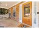 Inviting front porch featuring a wood door, stone accents, and swing at 3065 Willow Park Dr, Dacula, GA 30019