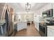 Modern kitchen with stainless steel appliances, quartz countertops, and plenty of storage space at 3065 Willow Park Dr, Dacula, GA 30019