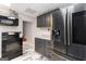 Modern kitchen featuring stainless steel appliances, and dark cabinetry at 3065 Willow Park Dr, Dacula, GA 30019
