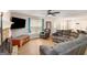 Open-concept living room with hardwood floors, stone fireplace, and lots of space for furniture at 3065 Willow Park Dr, Dacula, GA 30019