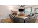 Cozy living room with a stone fireplace, hardwood floors, and natural light at 3065 Willow Park Dr, Dacula, GA 30019