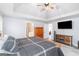 Relaxing main bedroom featuring a ceiling fan, TV, and furniture at 3065 Willow Park Dr, Dacula, GA 30019