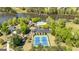 Breathtaking aerial showing a community clubhouse, pool, tennis courts, and lake for recreational enjoyment at 410 Wicklow St, Tyrone, GA 30290