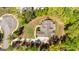 Aerial view of a well-maintained home featuring a long driveway and lush landscaping in a private setting at 410 Wicklow St, Tyrone, GA 30290