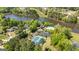 Overhead view of a lakeside community featuring a pool, tennis courts, a clubhouse, and beautifully landscaped grounds at 410 Wicklow St, Tyrone, GA 30290