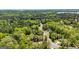 Beautiful aerial view of a neighborhood with mature trees and winding streets on a sunny day at 410 Wicklow St, Tyrone, GA 30290