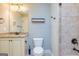 This bathroom has a nice vanity, toilet, and tiled shower at 410 Wicklow St, Tyrone, GA 30290