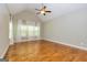 This vaulted bedroom has hardwood floors, lots of windows, and neutral colored walls at 410 Wicklow St, Tyrone, GA 30290