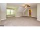 Spacious bedroom boasts natural light, plush carpeting, neutral paint, and easy access to an ensuite bathroom at 410 Wicklow St, Tyrone, GA 30290