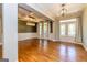Dining room with hardwood floors, modern lighting, and lots of light at 410 Wicklow St, Tyrone, GA 30290
