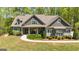Charming home with a covered front porch, well-manicured landscaping, and inviting curb appeal at 410 Wicklow St, Tyrone, GA 30290