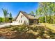 Home exterior with three car garage, basketball court, and large backyard at 410 Wicklow St, Tyrone, GA 30290