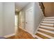The hallway features hardwood flooring and stairs with wood treads at 410 Wicklow St, Tyrone, GA 30290