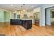 Updated kitchen with stainless steel appliances, a large island, and hardwood floors at 410 Wicklow St, Tyrone, GA 30290
