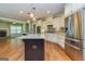 Modern kitchen with a large center island, stainless steel appliances, and beautiful countertops at 410 Wicklow St, Tyrone, GA 30290