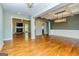Open concept living room featuring hardwood floors and fireplace at 410 Wicklow St, Tyrone, GA 30290