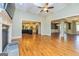 Bright, open living room features hardwood floors, stone fireplace, and open access to the kitchen at 410 Wicklow St, Tyrone, GA 30290