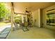 A covered patio with a table and chairs provides outdoor living space at 410 Wicklow St, Tyrone, GA 30290