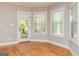 Bright sunroom with hardwood floors and a door to the patio at 410 Wicklow St, Tyrone, GA 30290