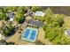 Aerial view of community amenities including tennis courts, pool, clubhouse, and ample parking by the lake at 410 Wicklow St, Tyrone, GA 30290
