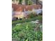Backyard with a white picket fence, manicured landscaping and garden at 411 Sherrels Frd, Peachtree City, GA 30269