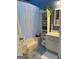 Charming bathroom featuring a shower-tub combination with a storage shelving unit at 411 Sherrels Frd, Peachtree City, GA 30269