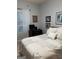 Comfortable bedroom featuring a queen bed, soft lighting, and a bright window at 411 Sherrels Frd, Peachtree City, GA 30269