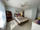 Cozy bedroom featuring a wooden bed frame and complemented by an elegant display case at 411 Sherrels Frd, Peachtree City, GA 30269