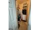 A walk-in closet offers ample storage space for clothing and accessories with a clean carpeted floor at 411 Sherrels Frd, Peachtree City, GA 30269