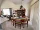 Cozy dining area with wood table, seating for four and a built-in china cabinet at 411 Sherrels Frd, Peachtree City, GA 30269