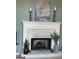 Elegant fireplace featuring a decorative mantel, providing a focal point and warmth to the living space at 411 Sherrels Frd, Peachtree City, GA 30269