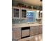 Updated kitchen with white cabinets, quartz countertops, and modern appliances at 411 Sherrels Frd, Peachtree City, GA 30269
