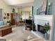 Open-concept living area with fireplace, dining area, and comfortable seating at 411 Sherrels Frd, Peachtree City, GA 30269